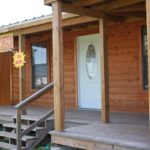 front porch and deck on ormeida's custom-built classic texas cabin model