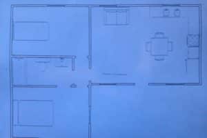 custom floorplan for ormeida's classic texas cabin drawn on a paper