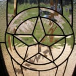 decorative glass on a custom cabin's front door with a star in the middle