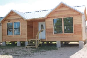 custom-built ormeida deluxe cabin in texas with one level and four front-facing windows,