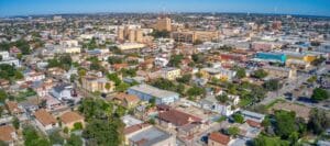 Expansive aerial shot of central Laredo, TX showing dense residential areas and urban buildings